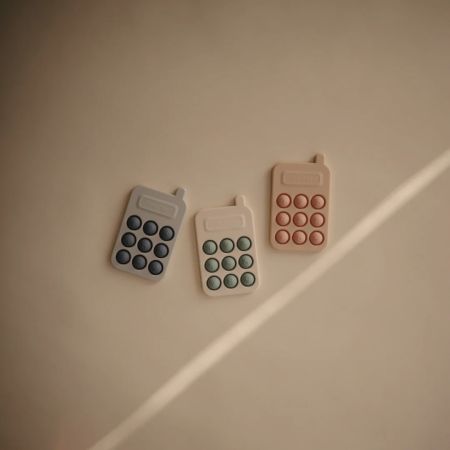 Jucarie senzoriala din silicon in forma de Telefon, +10 luni, Blush, Mushie 605226